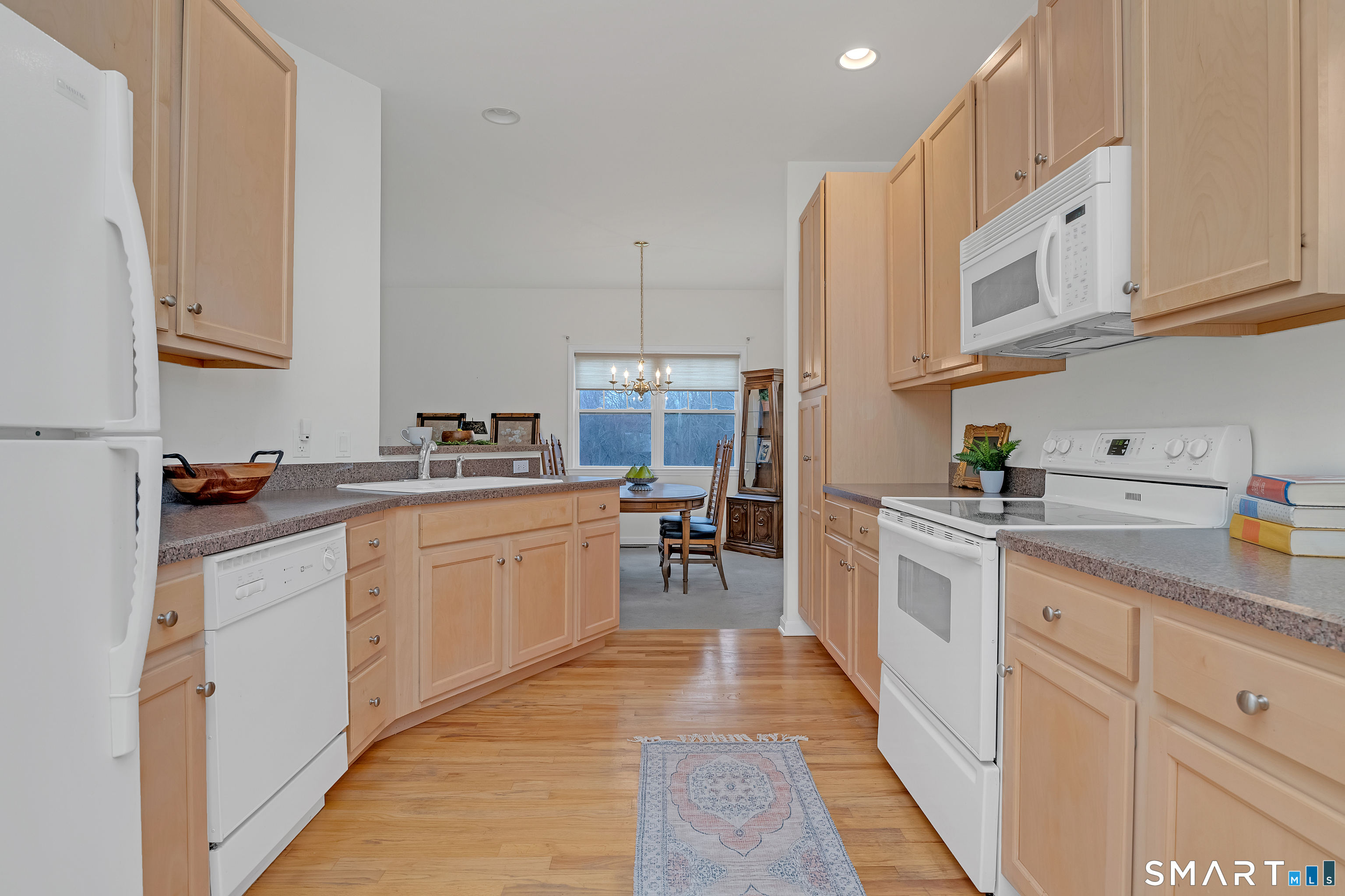 9 Pear Orchard Road, Unit 9 Portland, CT 06480 - Photo 16 of 38 a kitchen with stainless steel appliances granite countertop a sink and cabinets