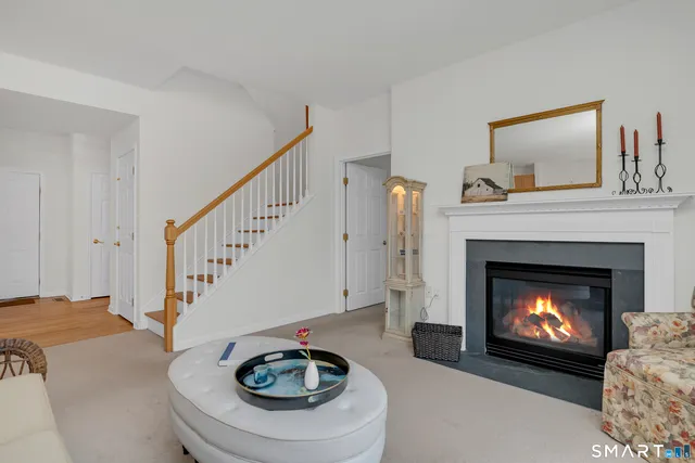 a living room with furniture a fireplace and a fireplace