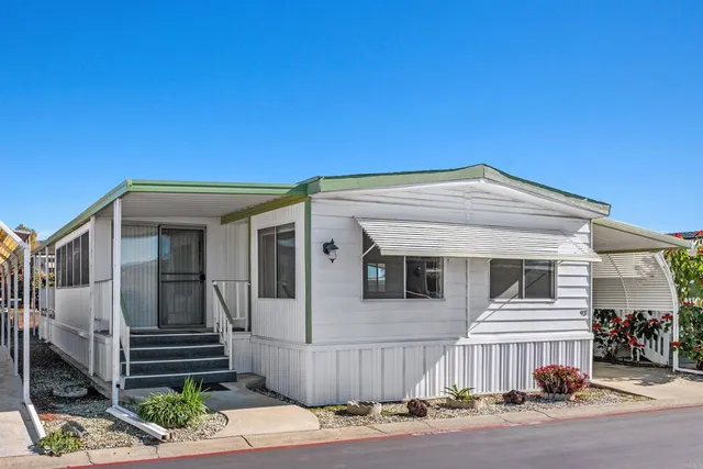 a front view of a house with a garage