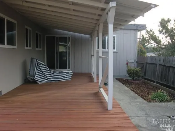 a view of outdoor space and wooden deck