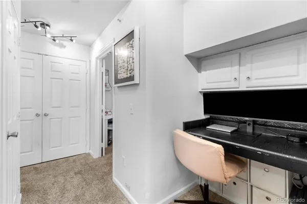 a kitchen with a sink cabinets and a stove