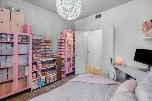 a bedroom with a bed and a book shelf