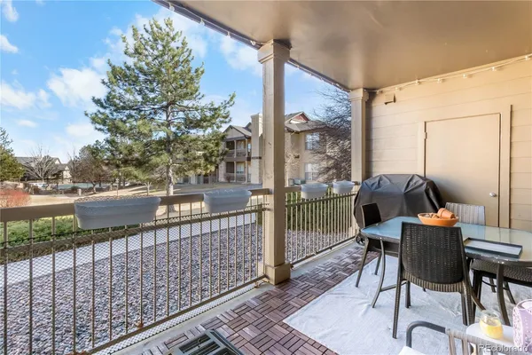 a balcony view with a seating space