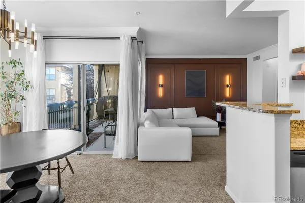 a living room with furniture and a table