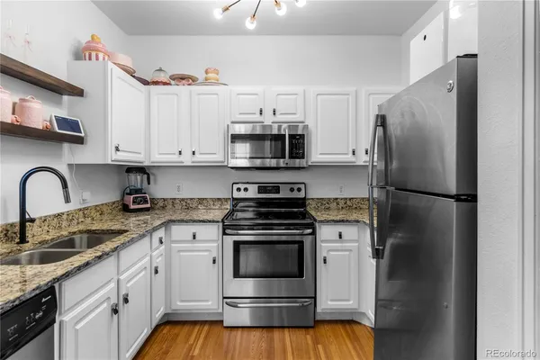 a kitchen with a stove and a refrigerator