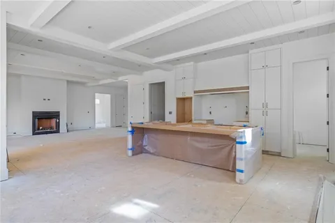 a room with painting and a lamp