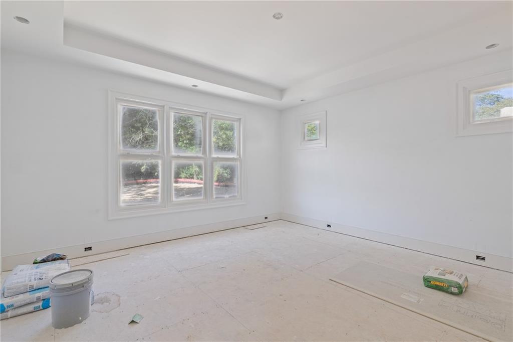 10908 Woodstock Road Roswell, GA 30075 - Photo 13 of 20 a view of wooden floor and window in a room