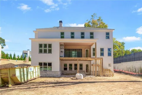 a view of a backyard with sitting area