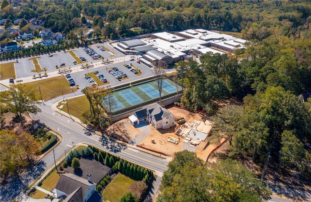 10908 Woodstock Road Roswell, GA 30075 - Photo 20 of 20 an aerial view of a house with swimming pool and outdoor seating