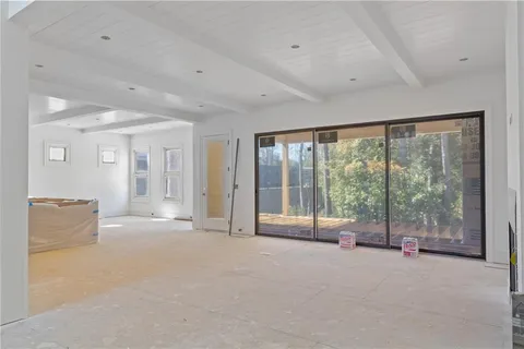a view of an empty room with a balcony
