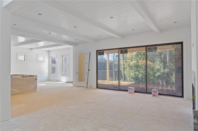 a view of an empty room with a balcony