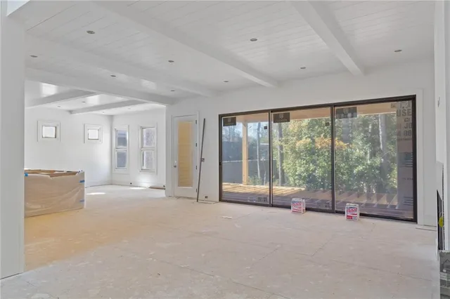a view of an empty room with a balcony