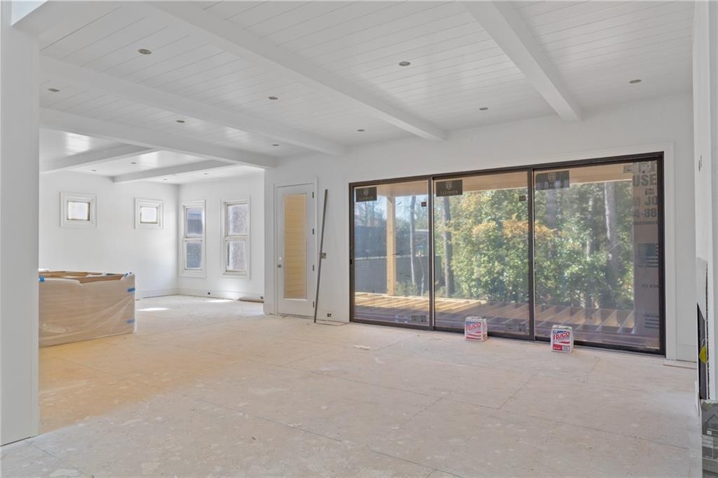 10908 Woodstock Road Roswell, GA 30075 - Photo 5 of 20 a view of an empty room with a balcony