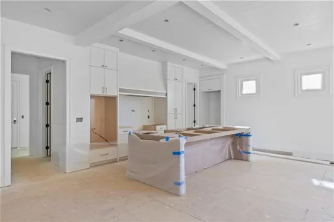 a kitchen with stainless steel appliances a stove and refrigerator