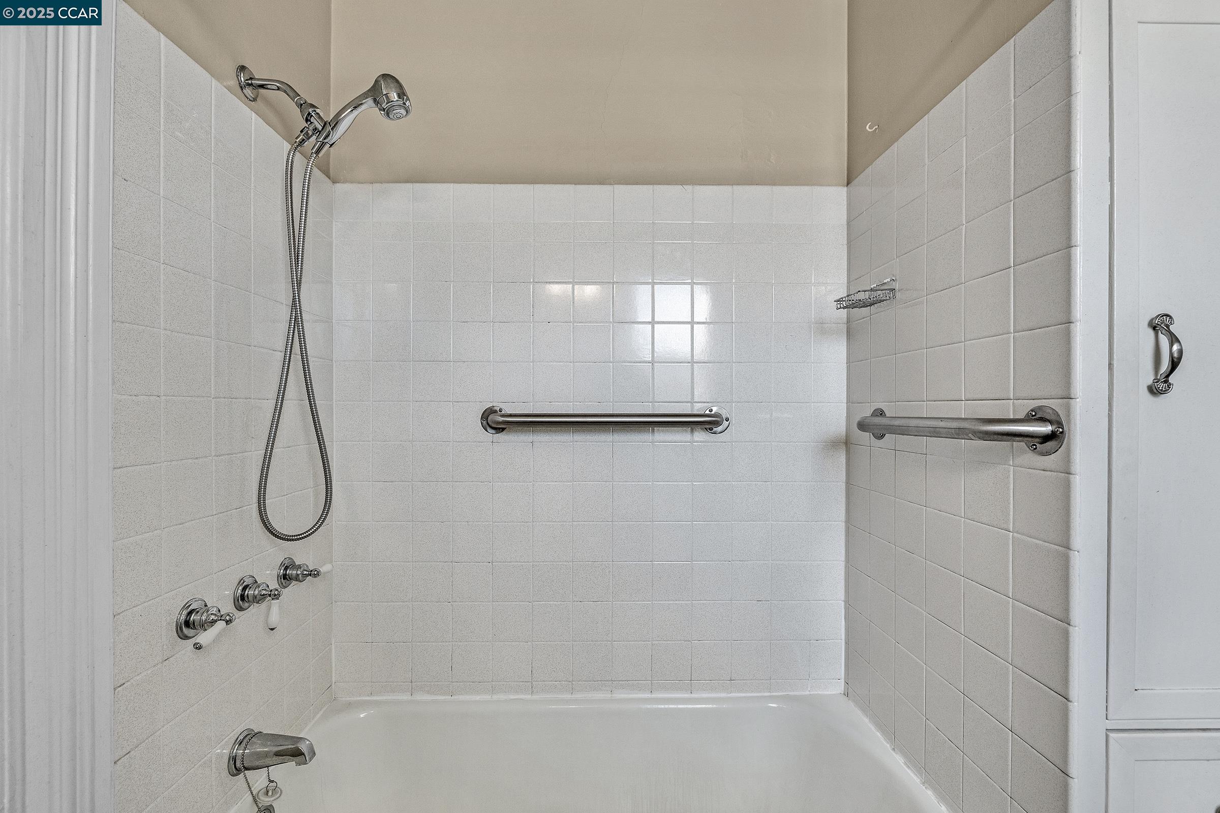 610 Quinan Street Pinole, CA 94564 - Photo 12 of 41 a bathroom with a bath tub with a shower