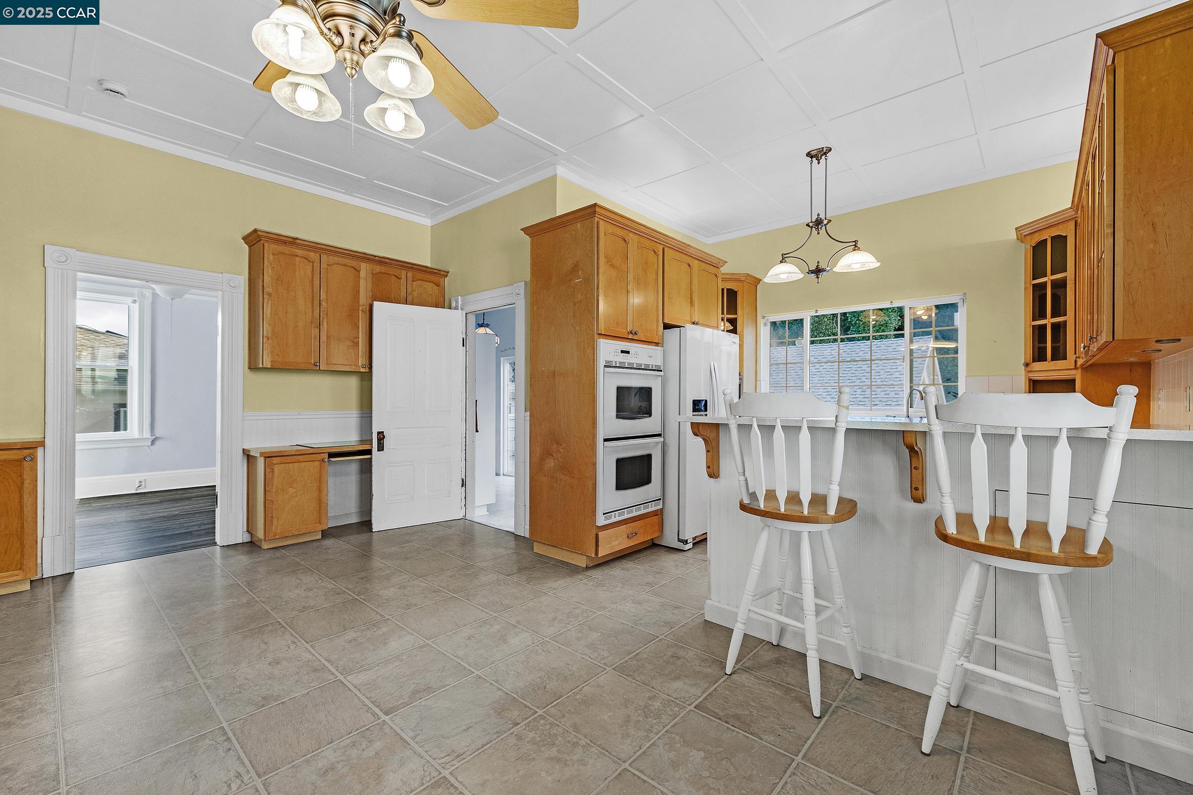 610 Quinan Street Pinole, CA 94564 - Photo 18 of 41 a view of a dining room with furniture and chandelier