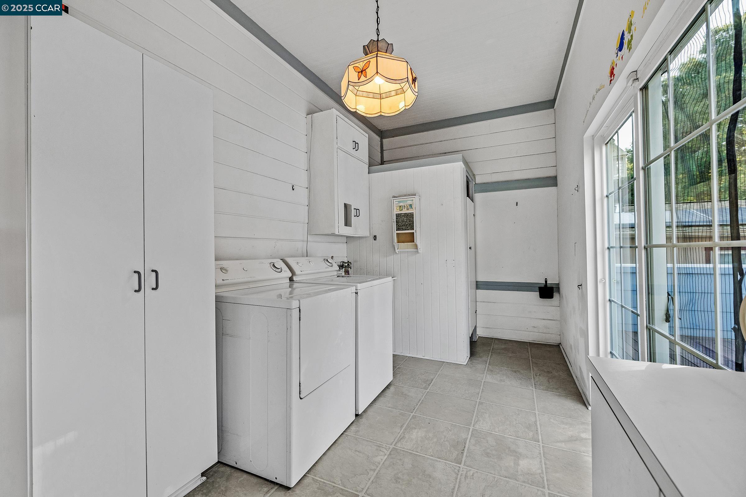 610 Quinan Street Pinole, CA 94564 - Photo 19 of 41 a view of a hallway with washer and dryer