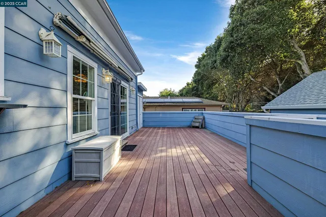 a view of a house with wooden fence