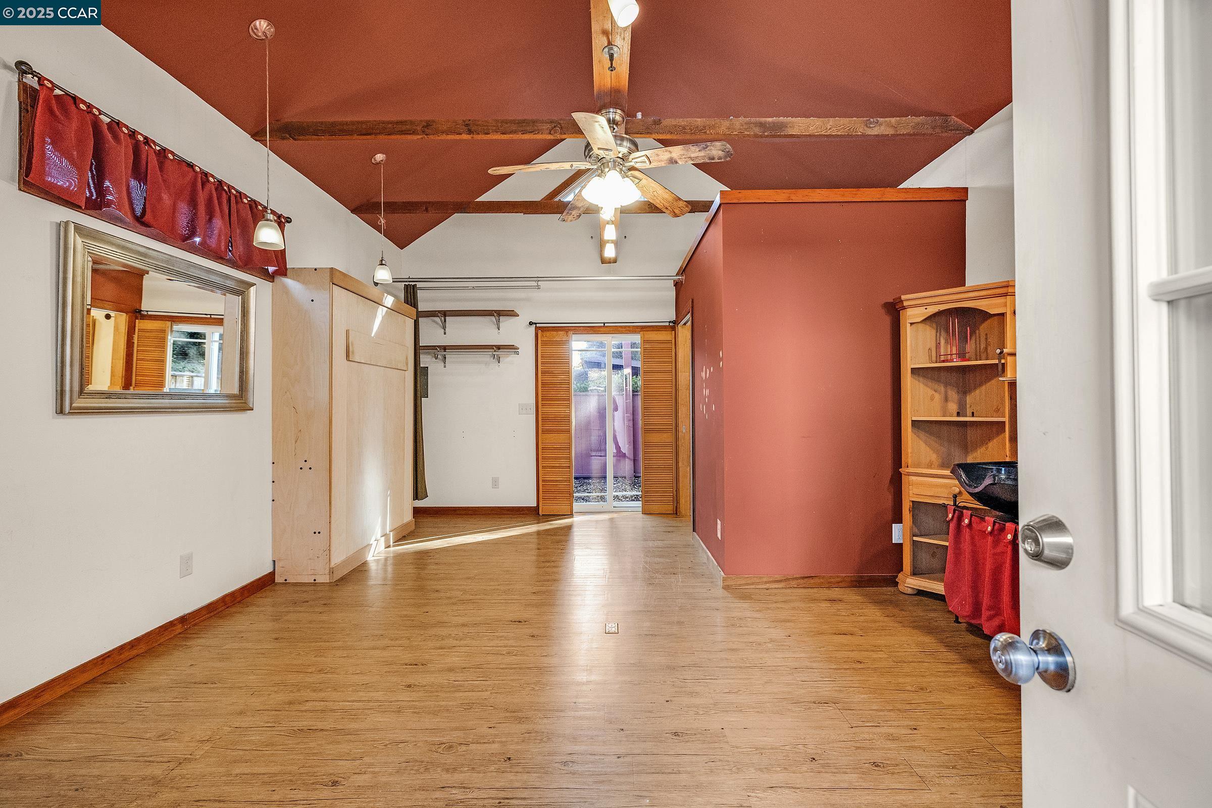 610 Quinan Street Pinole, CA 94564 - Photo 25 of 41 a view of an empty room with bookshelf and a window