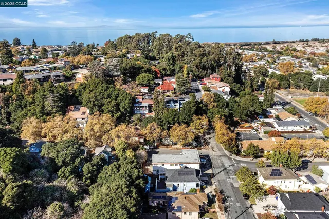 an aerial view of a houses with yard