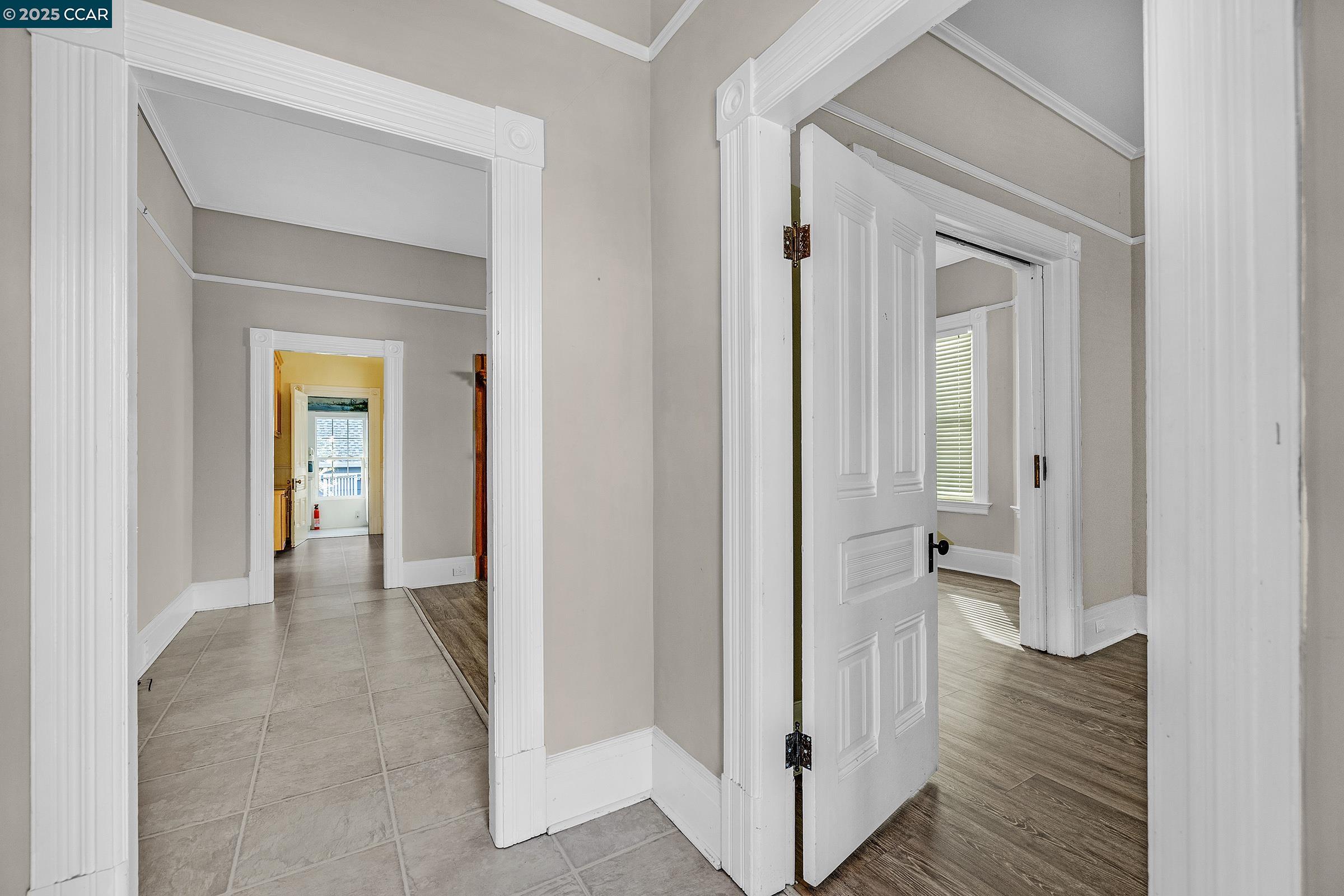 610 Quinan Street Pinole, CA 94564 - Photo 4 of 41 a view of a hallway with wooden floor