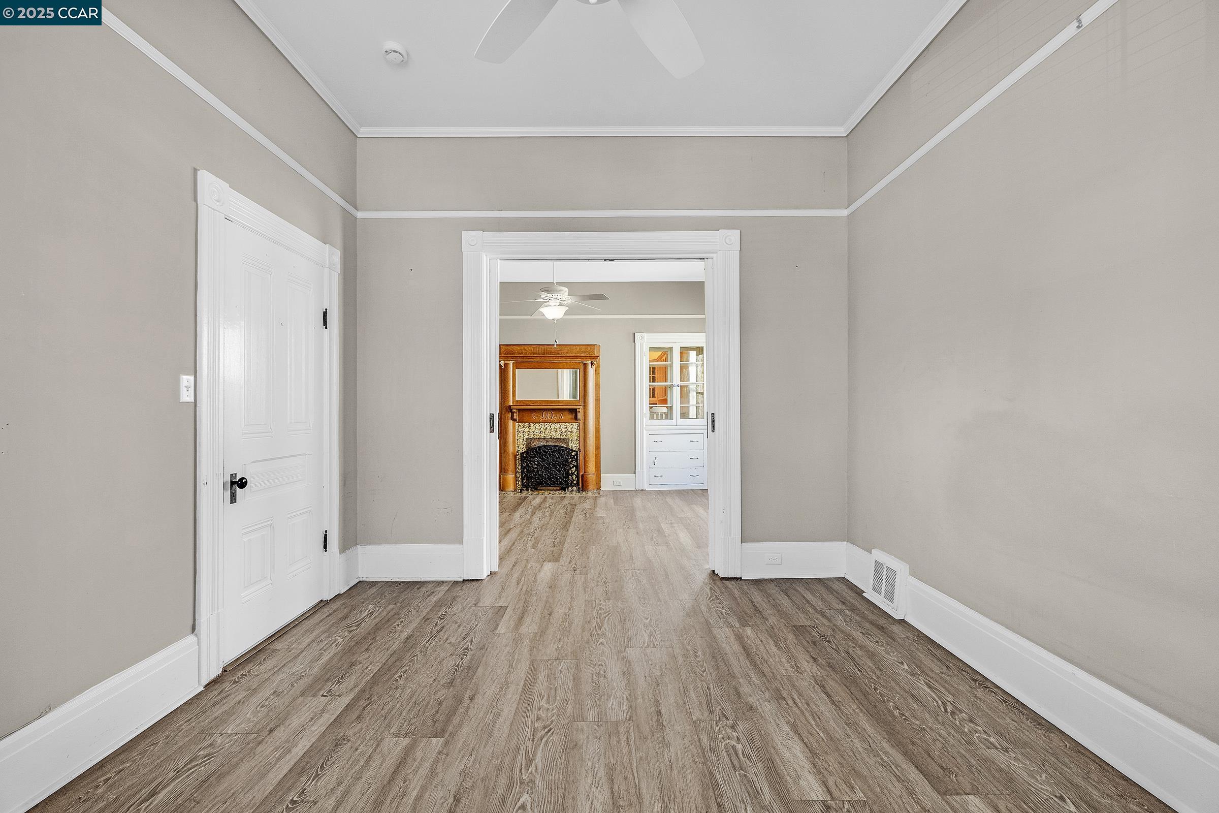 610 Quinan Street Pinole, CA 94564 - Photo 7 of 41 an empty room with wooden floor and closet