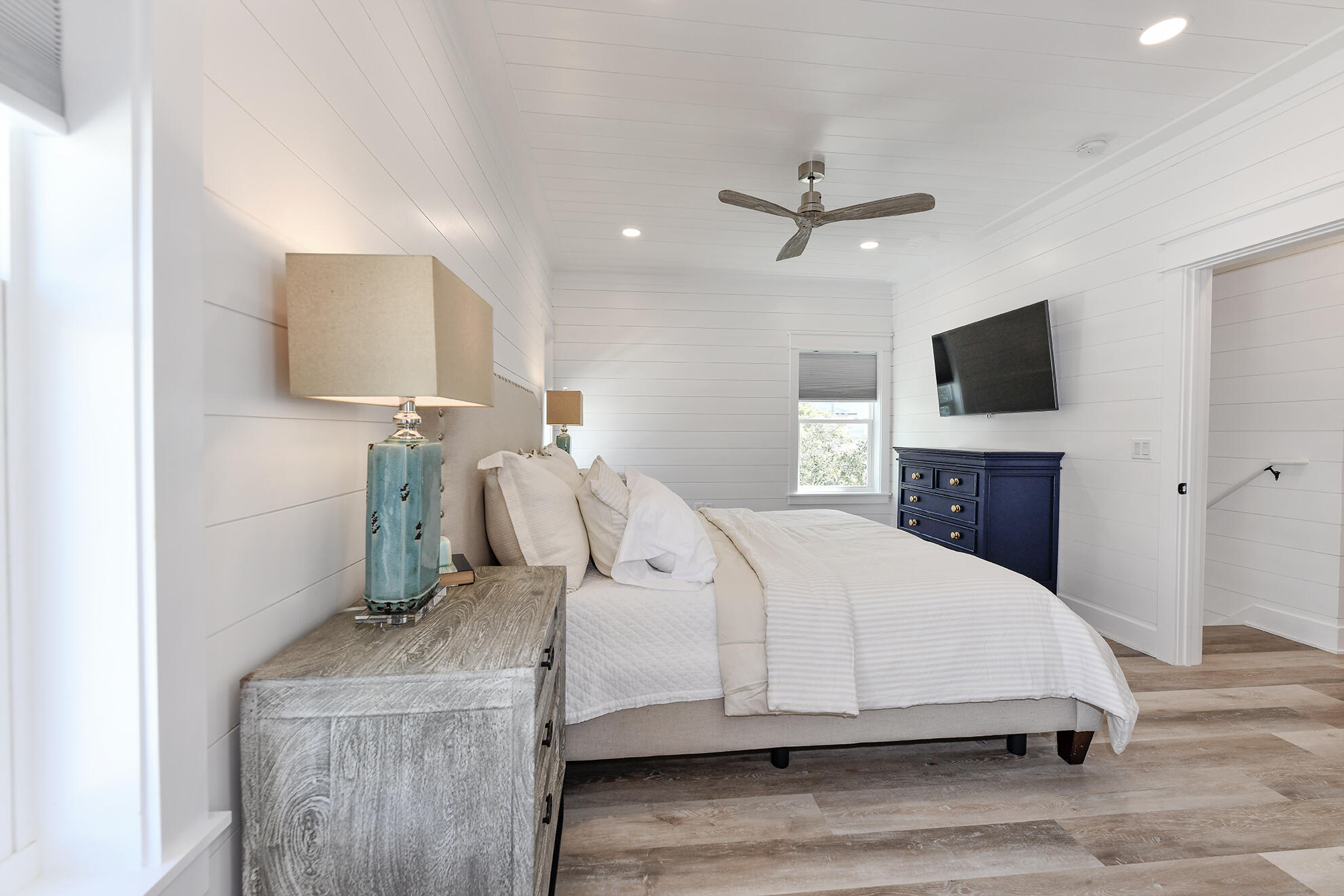 20 Brown Street Santa Rosa Beach, FL 32459 - Photo 57 of 83 a bedroom with a bed and a flat screen tv