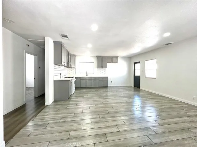 a view of kitchen and kitchen with sink