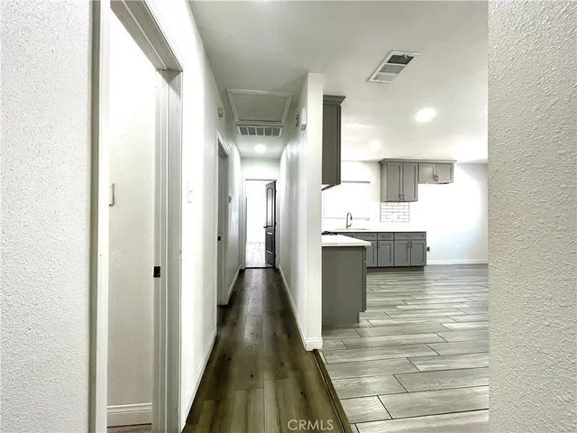 a bathroom with a sink a mirror and shower