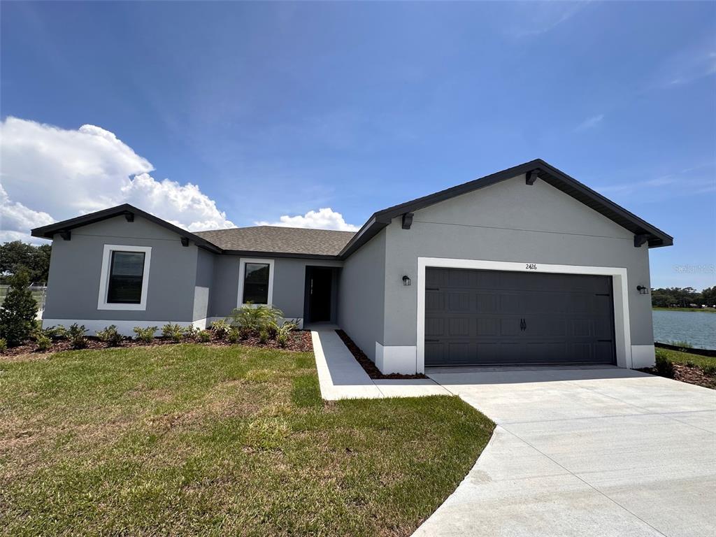 2426 Hiers Road Dover, FL 33527 - Photo 2 of 8 a front view of house with garage