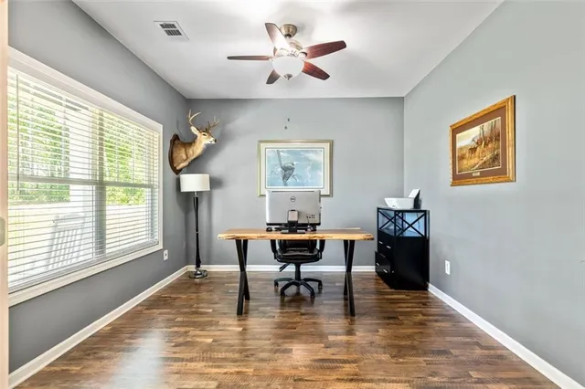 a view of a livingroom with a kitchen