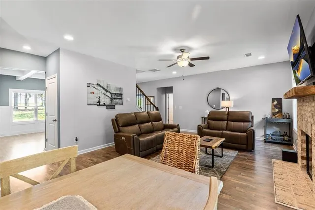 a kitchen with stainless steel appliances granite countertop a refrigerator sink and stove