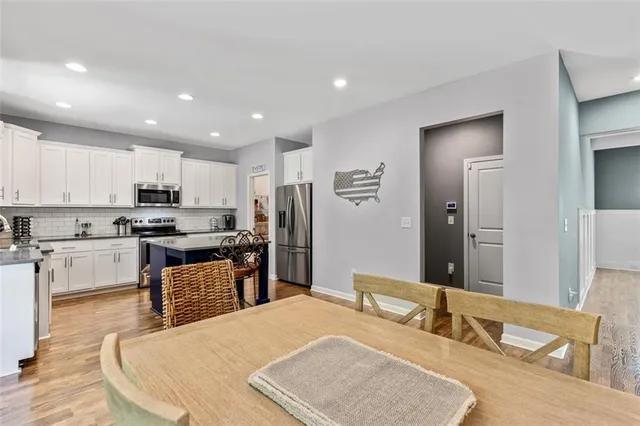 a kitchen with sink and cabinets