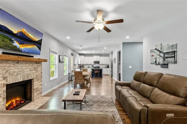 a living room with furniture and a fireplace