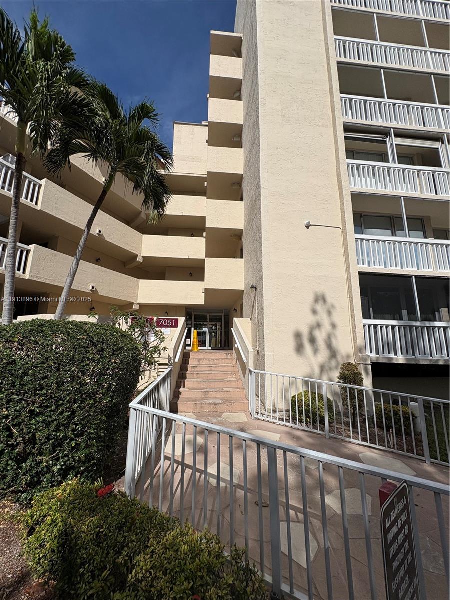 a view of balcony with wooden floor and plants
