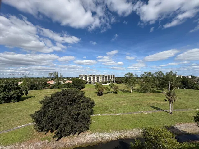 a view of a lake with a yard