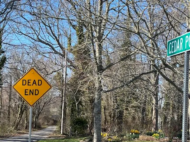 a sign broad on the side of a road