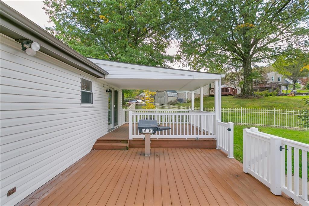 25 Pheasant Run Drive Export, PA 15632 - Photo 12 of 25 a view of a deck with a large window and wooden floor