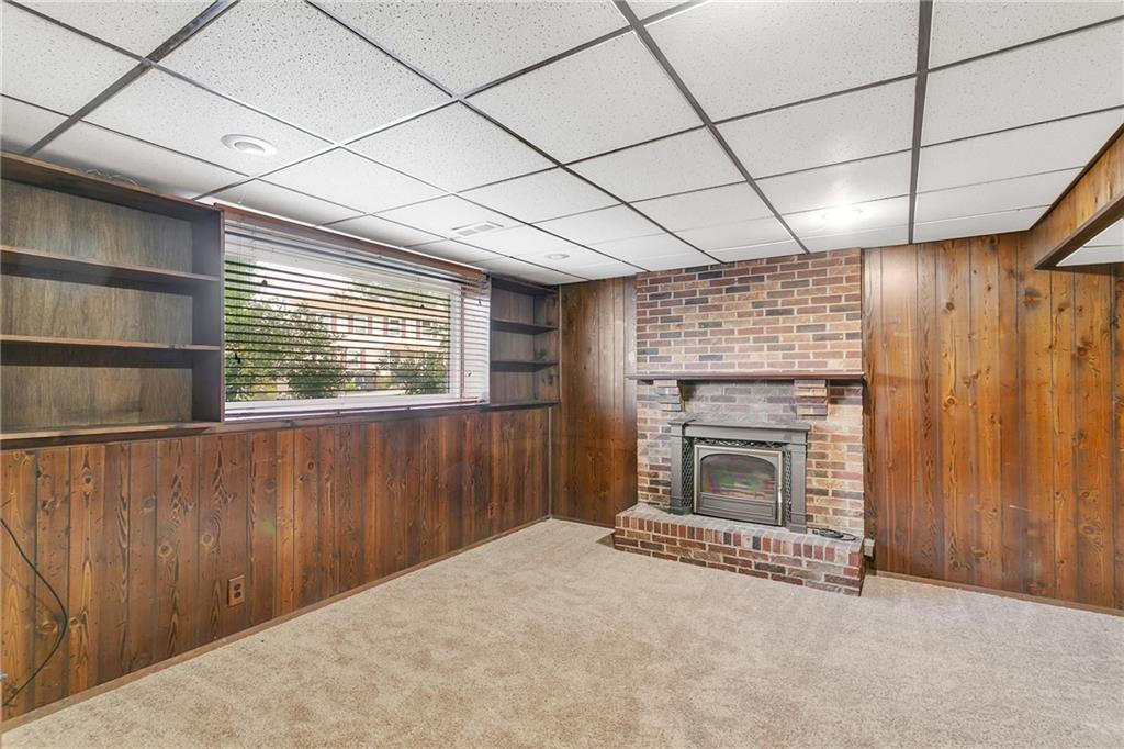 25 Pheasant Run Drive Export, PA 15632 - Photo 20 of 25 a view of an empty room with a fireplace and a window