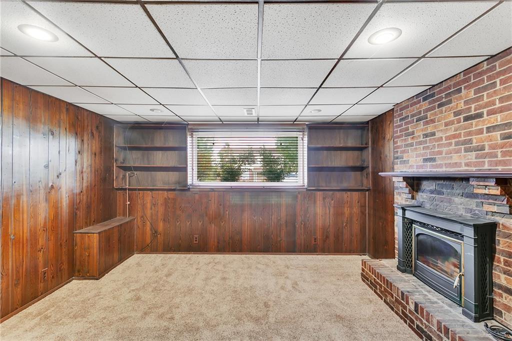 25 Pheasant Run Drive Export, PA 15632 - Photo 21 of 25 a view of an empty room with a fireplace and a window