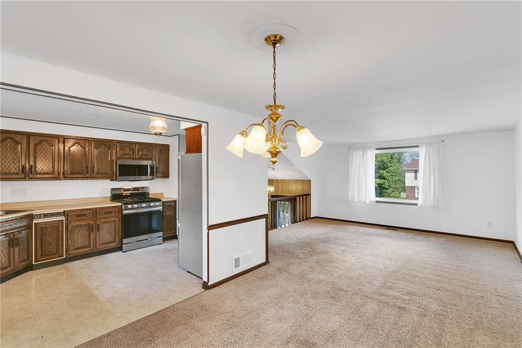 25 Pheasant Run Drive Export, PA 15632 - Photo 6 of 25 a view of a kitchen with a sink stove and a refrigerator