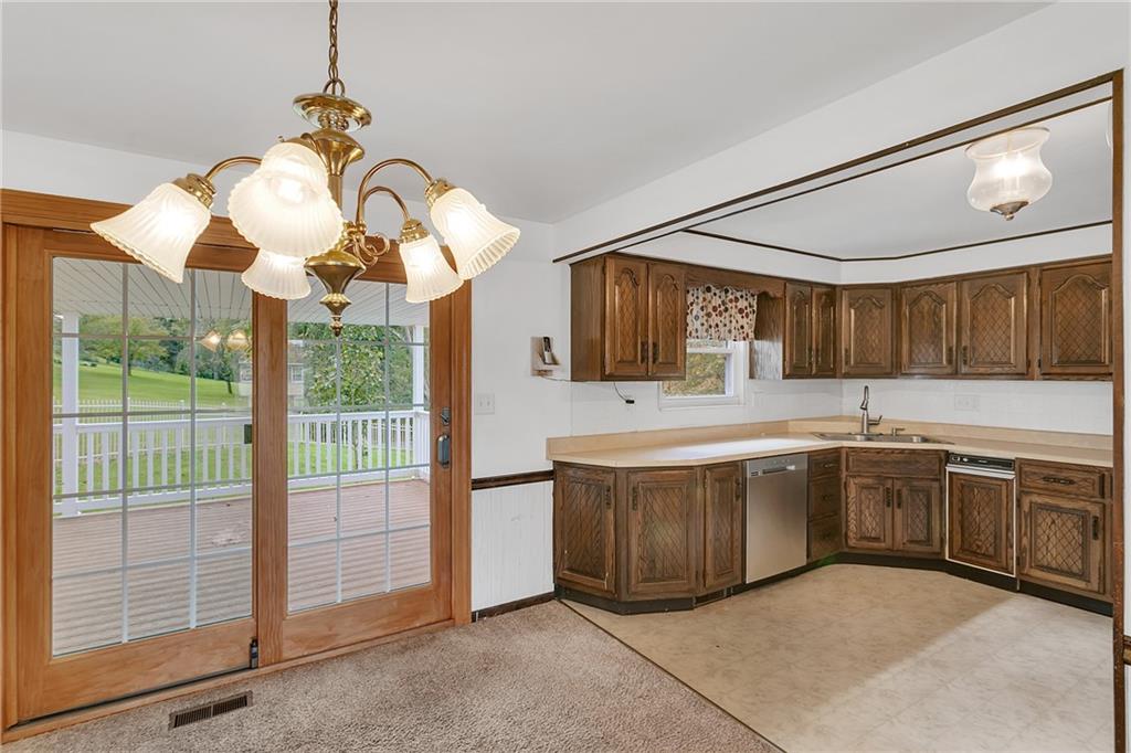 25 Pheasant Run Drive Export, PA 15632 - Photo 10 of 25 a large kitchen with kitchen island granite countertop a sink and large cabinets