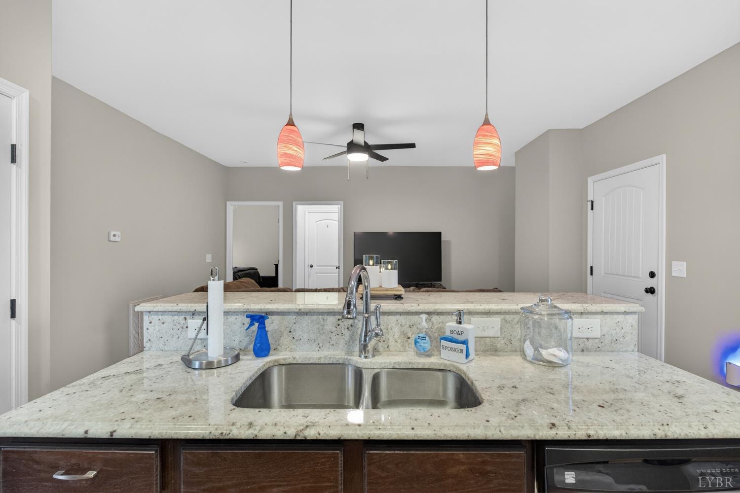 1198 Crest Ridge Drive Bedford, VA 24523 - Photo 12 of 40 a kitchen with granite countertop a sink a counter top space and cabinets