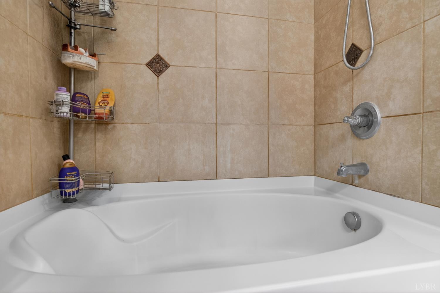 1198 Crest Ridge Drive Bedford, VA 24523 - Photo 15 of 40 a bathroom with a bath tub and a shower
