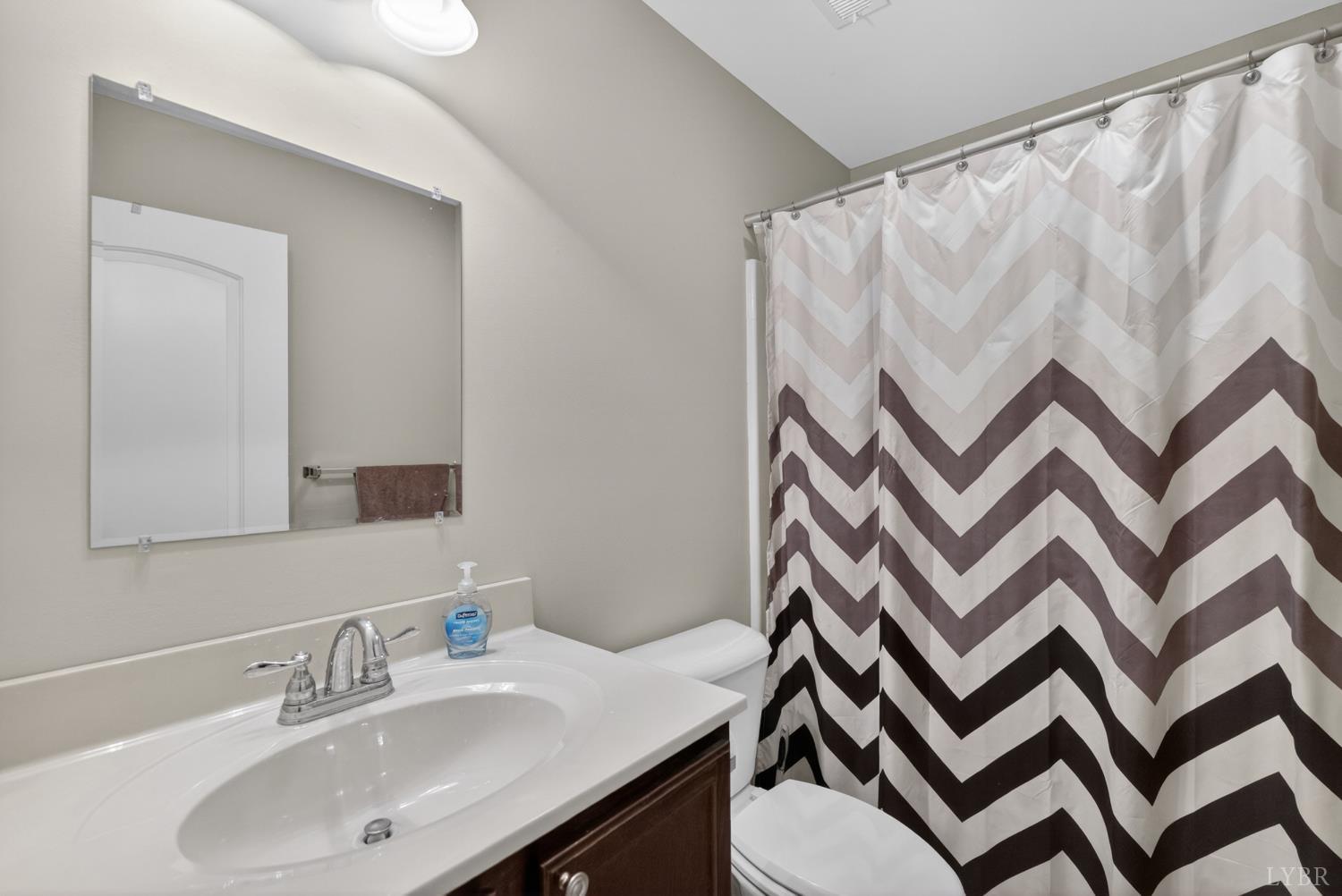 1198 Crest Ridge Drive Bedford, VA 24523 - Photo 18 of 40 a bathroom with a sink and a mirror
