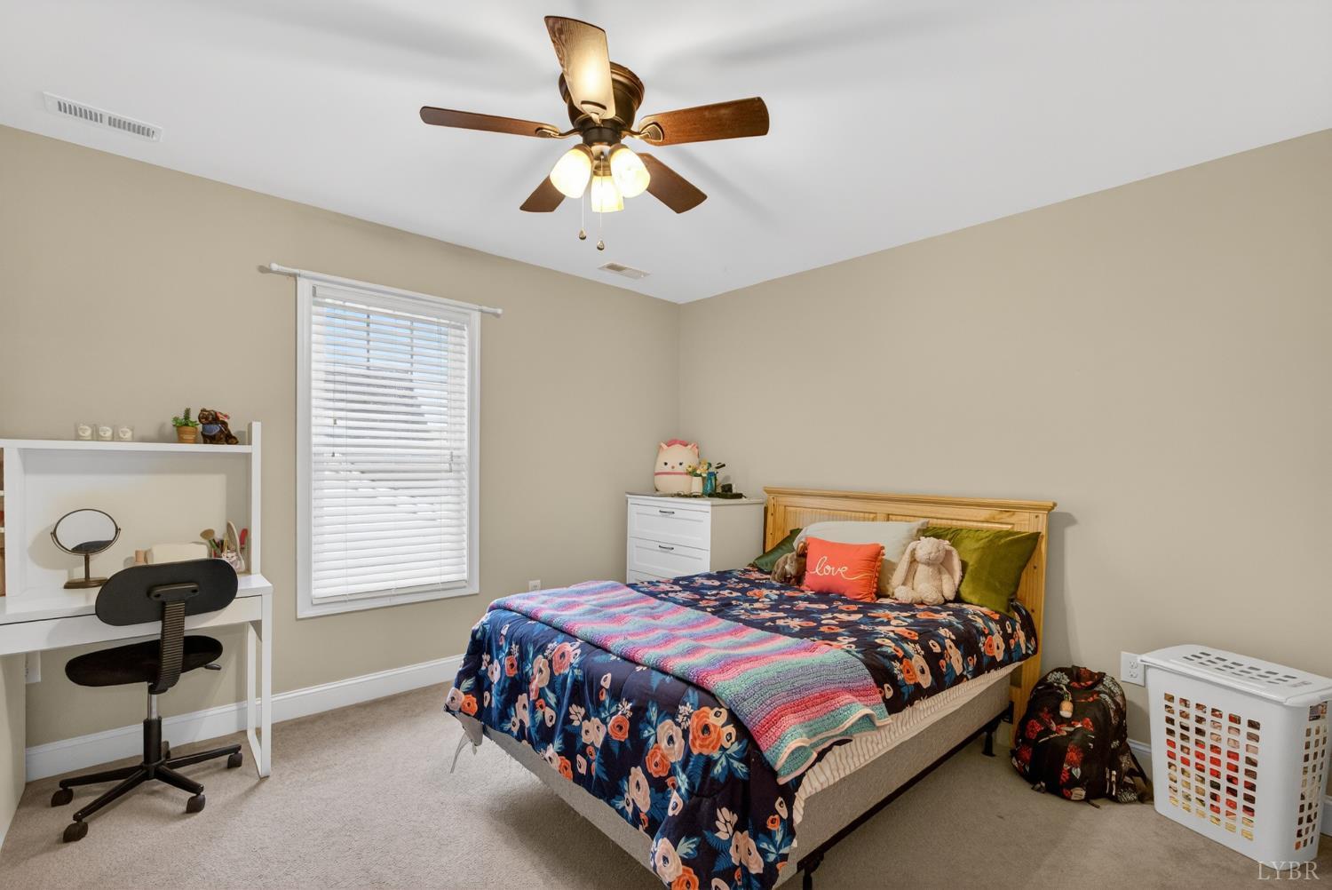1198 Crest Ridge Drive Bedford, VA 24523 - Photo 21 of 40 a bedroom with a bed and a chandelier
