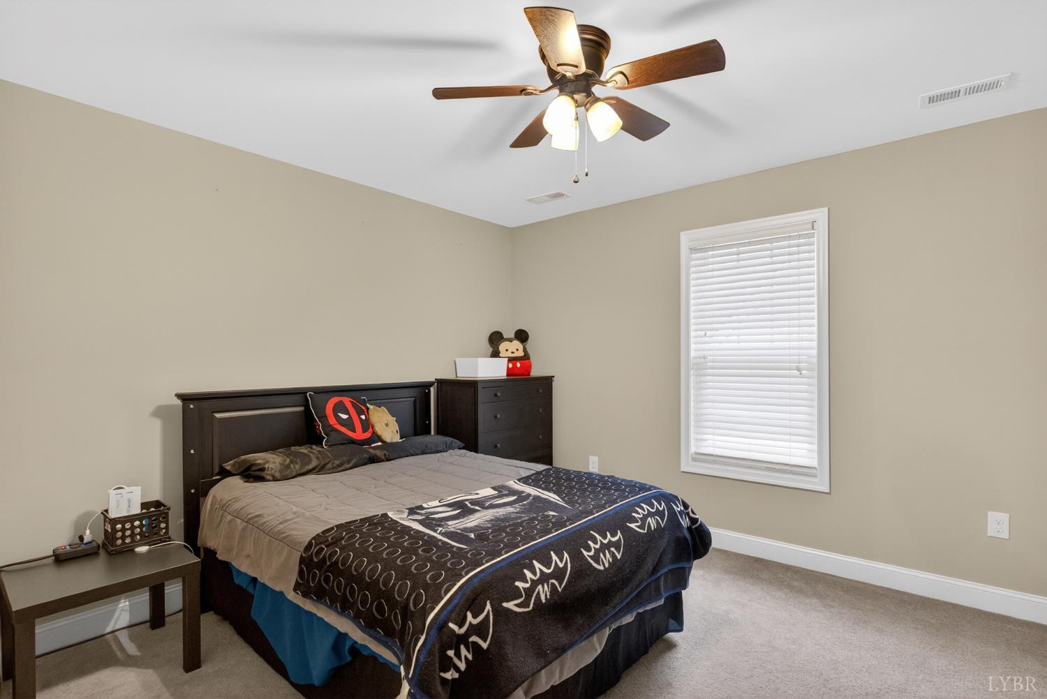 1198 Crest Ridge Drive Bedford, VA 24523 - Photo 22 of 40 a bedroom with a bed and a chandelier
