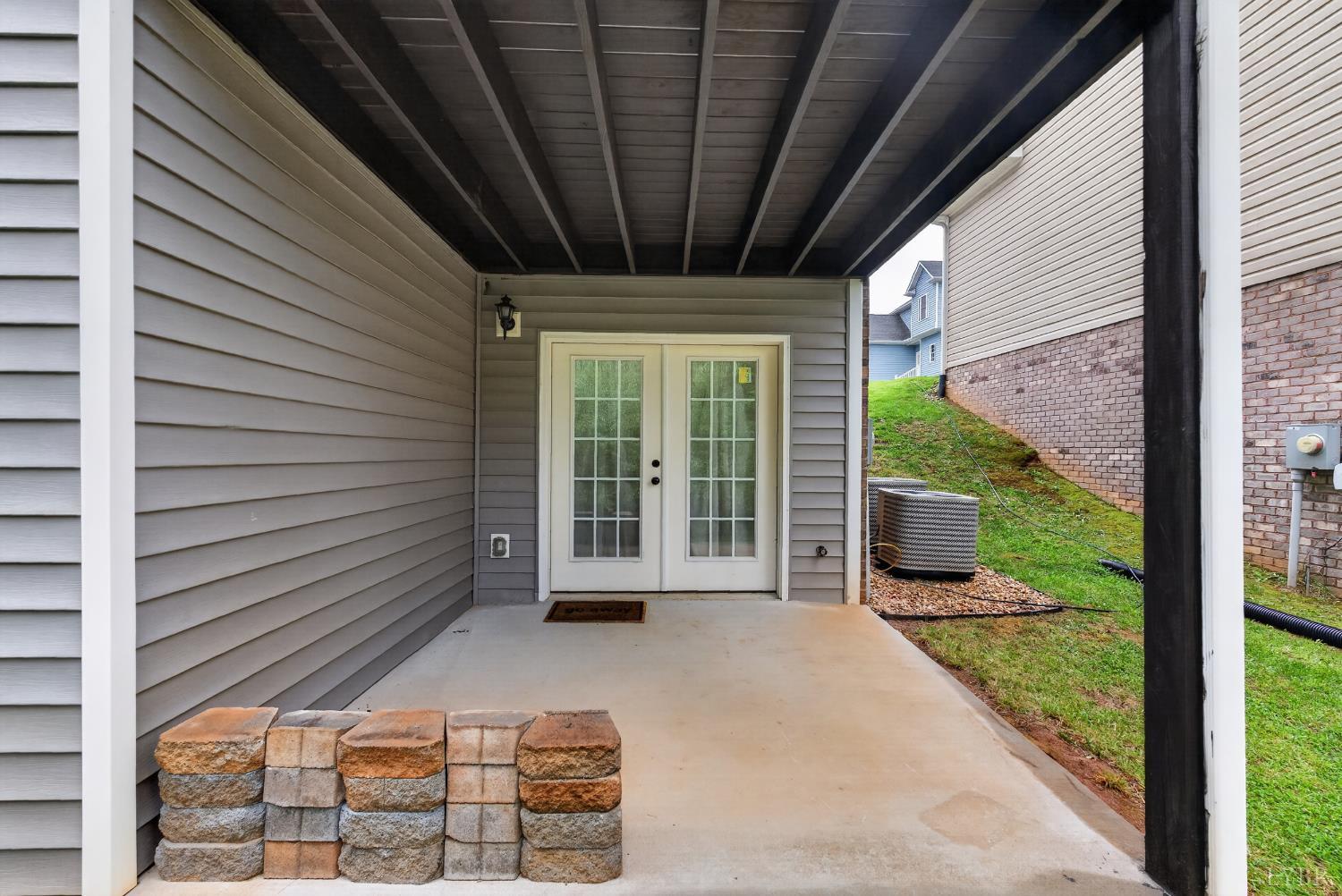 1198 Crest Ridge Drive Bedford, VA 24523 - Photo 34 of 40 a view of a patio with table and chairs and potted plants