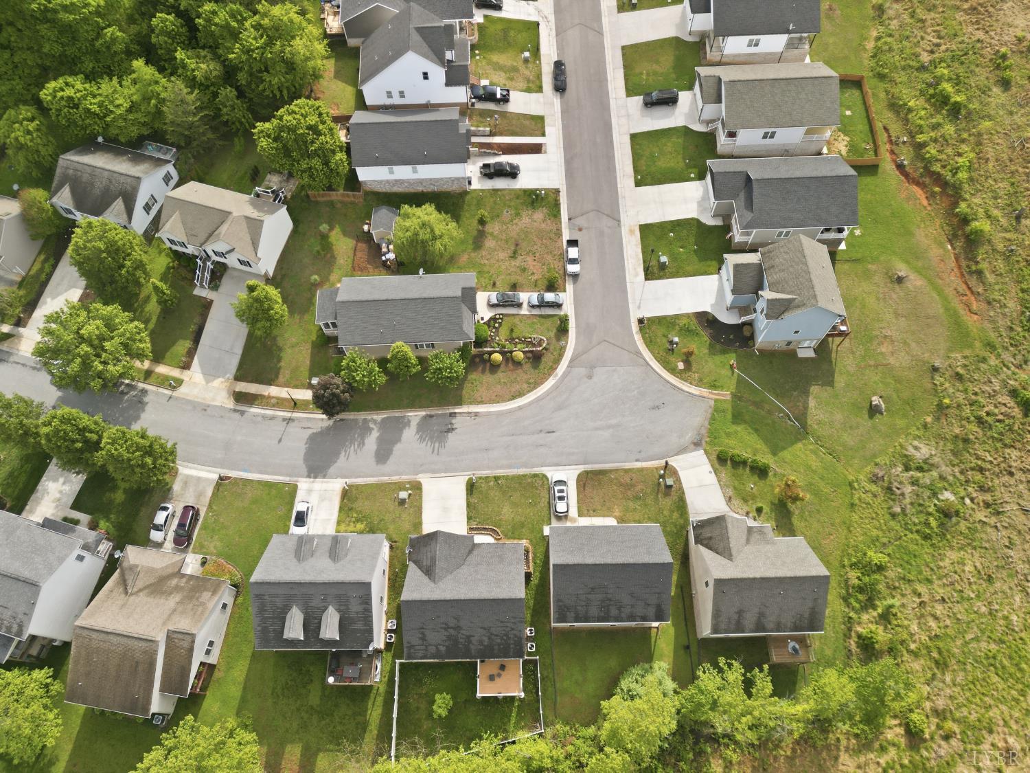 1198 Crest Ridge Drive Bedford, VA 24523 - Photo 39 of 40 an aerial view of residential houses with outdoor space and parking