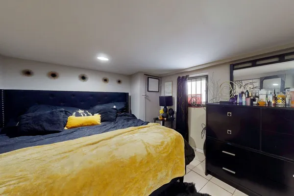 a bed room with a bed and a mirror